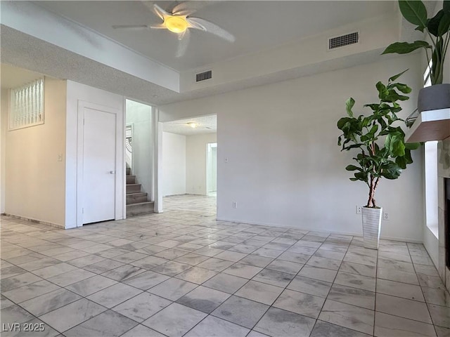 5600 Grossmont Ave, Las Vegas, NV 89110 - unfurnished room with stairway, a ceiling fan, and baseboards