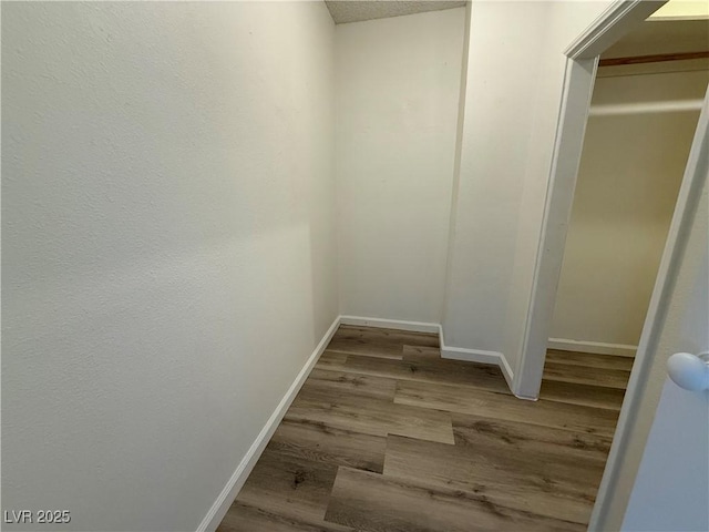 5600 Grossmont Ave, Las Vegas, NV 89110 - corridor with baseboards and wood finished floors