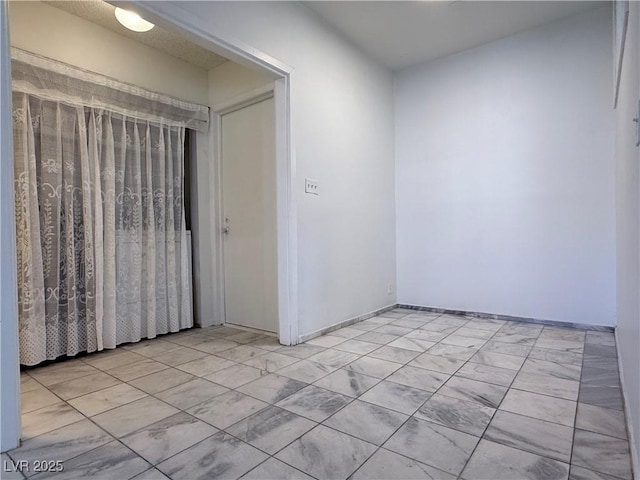 5600 Grossmont Ave, Las Vegas, NV 89110 - empty room featuring light marble finish flooring