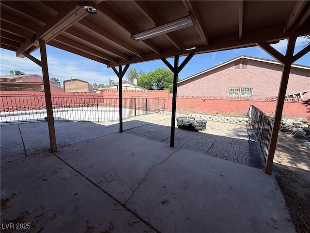 5600 Grossmont Ave, Las Vegas, NV 89110 - fenced backyard with a patio area