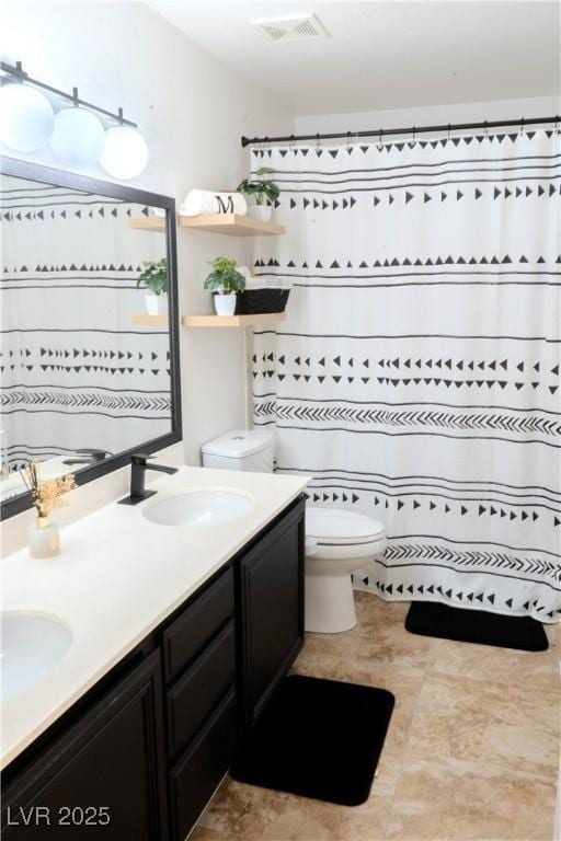 2549 Sundew Ave, Henderson, NV 89052 - full bath featuring toilet, double vanity, and a shower with shower curtain