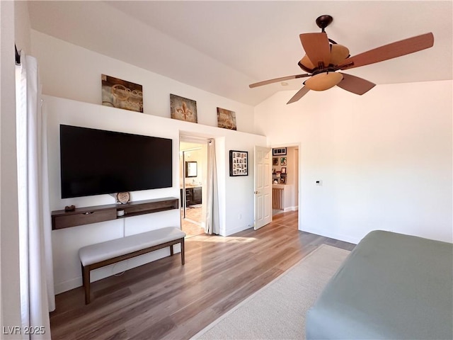 2549 Sundew Ave, Henderson, NV 89052 - bedroom featuring wood finished floors, baseboards, high vaulted ceiling, connected bathroom, and ceiling fan