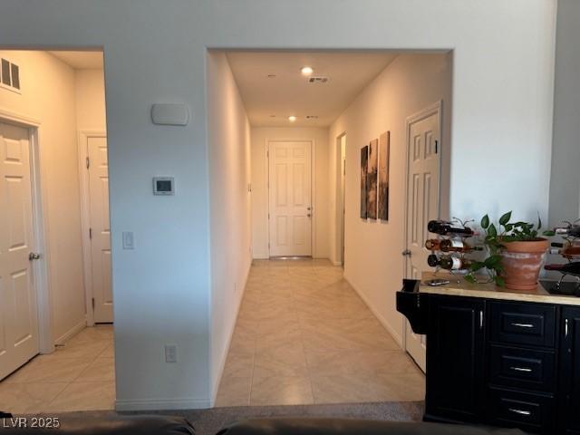 411 Hellebores Ave, North Las Vegas, NV 89084 - hall featuring light tile patterned floors, recessed lighting, and baseboards