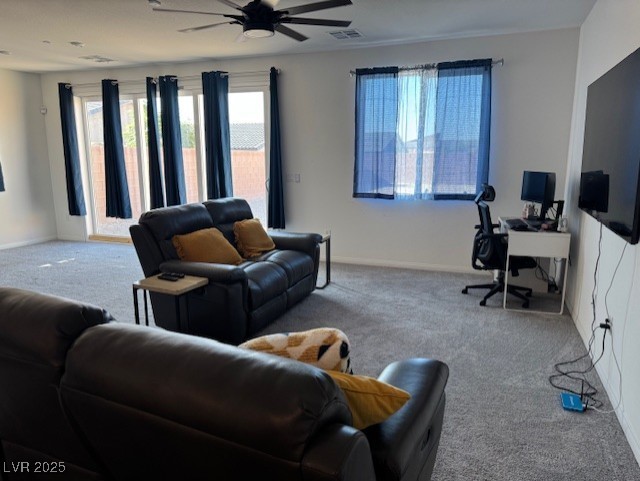 411 Hellebores Ave, North Las Vegas, NV 89084 - carpeted living room with a ceiling fan, a desk, and baseboards