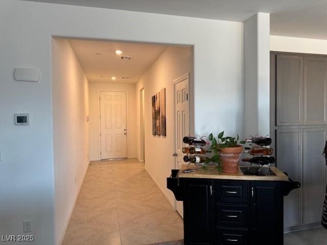 411 Hellebores Ave, North Las Vegas, NV 89084 - hallway with light tile patterned flooring, baseboards, and recessed lighting