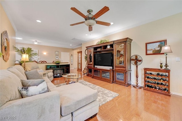2545 Nashira St, Henderson, NV 89044 - living area featuring ornamental molding, light wood-style floors, ceiling fan, baseboards, and recessed lighting