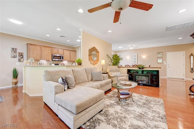 2545 Nashira St, Henderson, NV 89044 - living room with light wood-type flooring, a ceiling fan, ornamental molding, recessed lighting, and baseboards