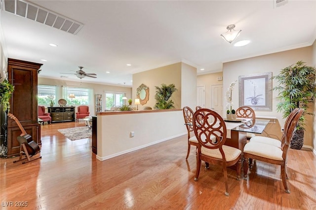 2545 Nashira St, Henderson, NV 89044 - dining area with light wood-style flooring, baseboards, recessed lighting, ornamental molding, and ceiling fan