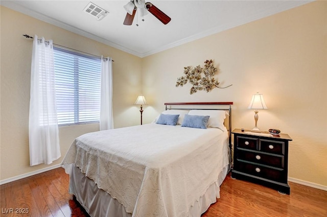 2545 Nashira St, Henderson, NV 89044 - bedroom with wood finished floors, baseboards, ornamental molding, and ceiling fan