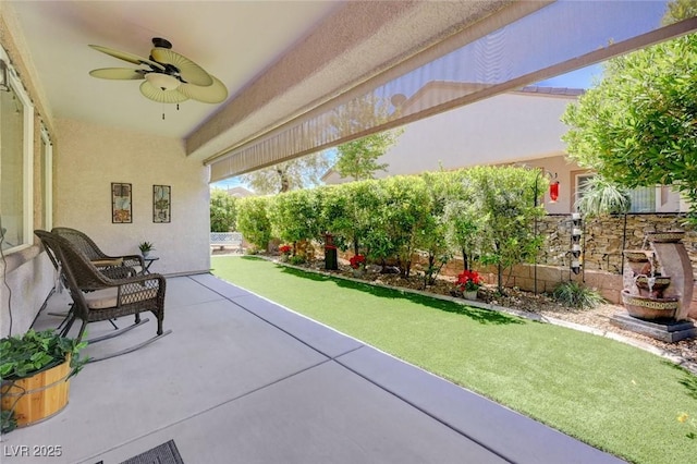 2545 Nashira St, Henderson, NV 89044 - fenced backyard featuring a ceiling fan and a patio area