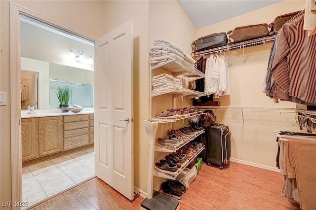 2545 Nashira St, Henderson, NV 89044 - walk in closet with light wood-type flooring and a sink