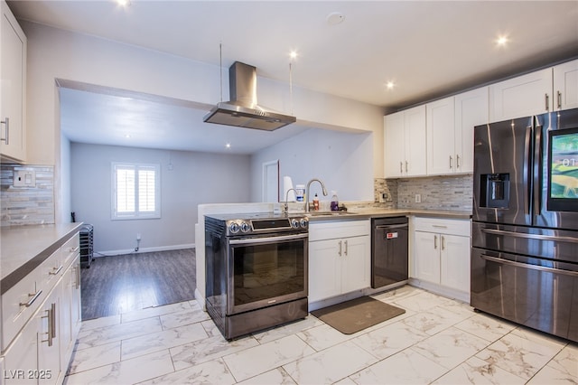 237 Cervantes St, Las Vegas, NV 89101 - kitchen featuring appliances with stainless steel finishes, wall chimney range hood, light marble finish floors, a sink, and white cabinetry