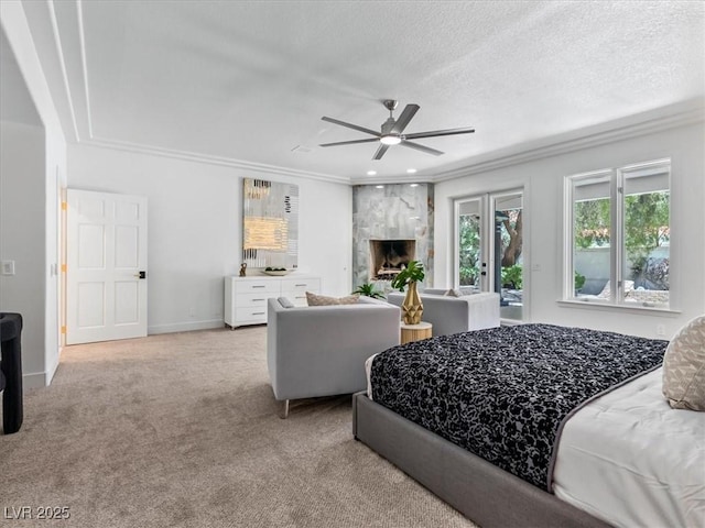21 Sawgrass Ct, Las Vegas, NV 89113 - bedroom with crown molding, light colored carpet, a textured ceiling, a premium fireplace, and access to outside