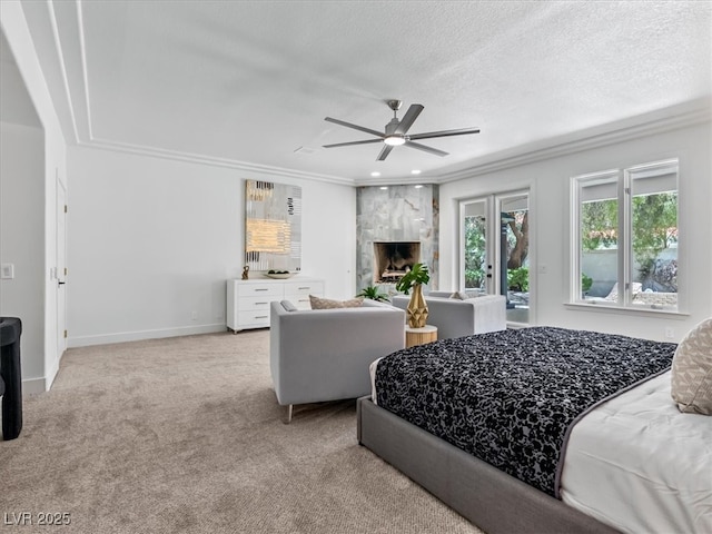 21 Sawgrass Ct, Las Vegas, NV 89113 - bedroom featuring light colored carpet, ornamental molding, a textured ceiling, a premium fireplace, and access to outside