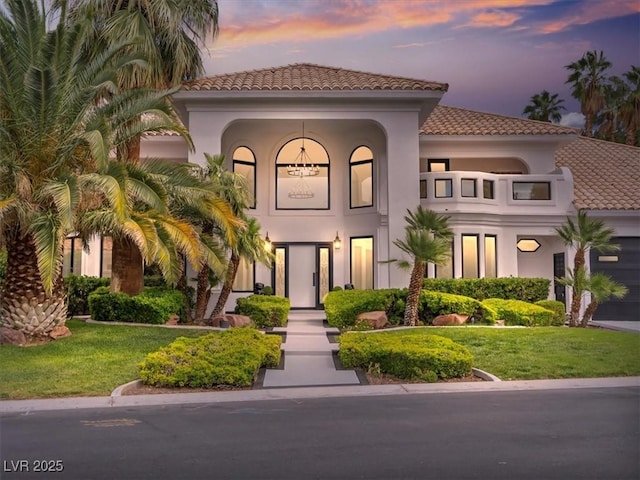 21 Sawgrass Ct, Las Vegas, NV 89113 - mediterranean / spanish-style house with a tiled roof, stucco siding, and a lawn