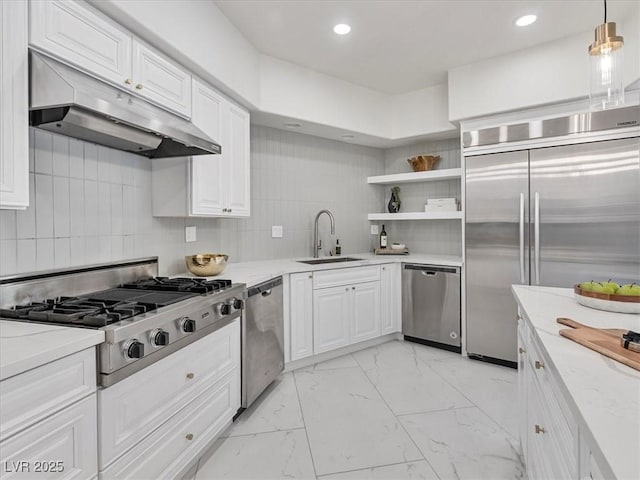 21 Sawgrass Ct, Las Vegas, NV 89113 - kitchen with a sink, stainless steel appliances, under cabinet range hood, light marble finish flooring, and white cabinetry