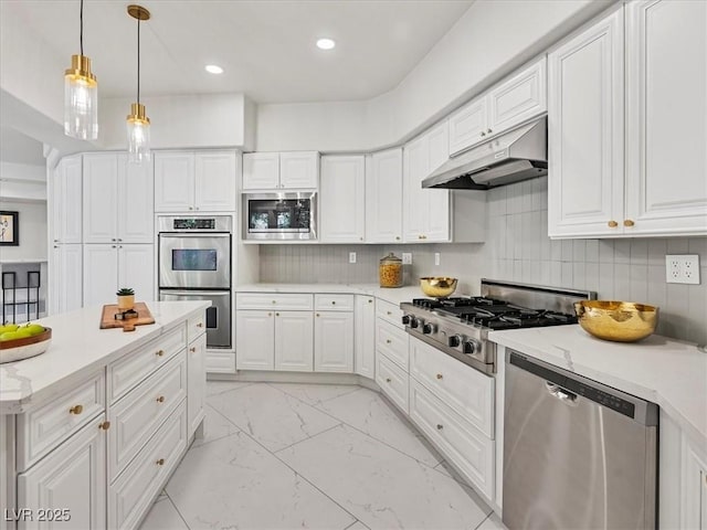 21 Sawgrass Ct, Las Vegas, NV 89113 - kitchen featuring appliances with stainless steel finishes, under cabinet range hood, light marble finish flooring, white cabinetry, and recessed lighting