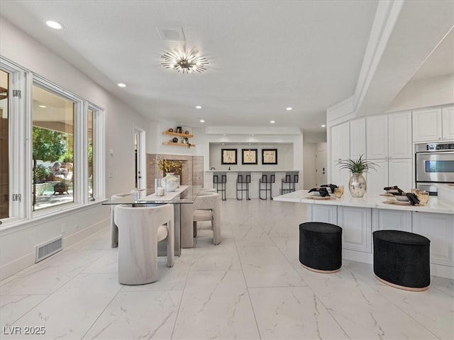 21 Sawgrass Ct, Las Vegas, NV 89113 - dining area featuring recessed lighting and light marble finish flooring