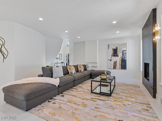 21 Sawgrass Ct, Las Vegas, NV 89113 - living room featuring recessed lighting, a large fireplace, stairway, and marble finish floors