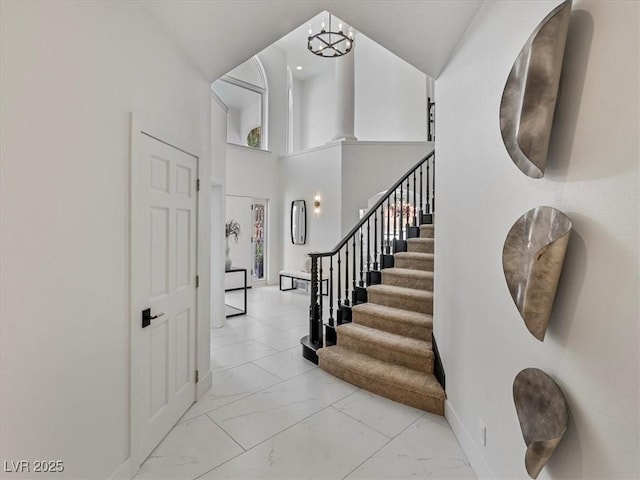 21 Sawgrass Ct, Las Vegas, NV 89113 - foyer with light marble finish floors, baseboards, and stairs