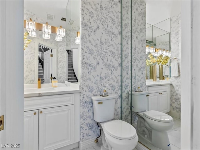 21 Sawgrass Ct, Las Vegas, NV 89113 - full bathroom with toilet, vanity, wallpapered walls, and baseboards