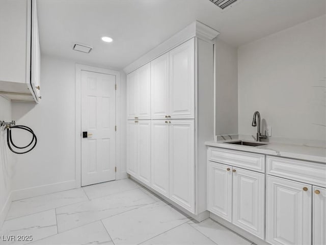 21 Sawgrass Ct, Las Vegas, NV 89113 - washroom featuring light marble finish floors, baseboards, and recessed lighting