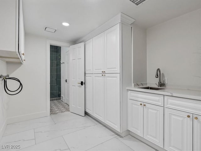 21 Sawgrass Ct, Las Vegas, NV 89113 - full bath with marble finish floors, baseboards, recessed lighting, vanity, and tiled shower