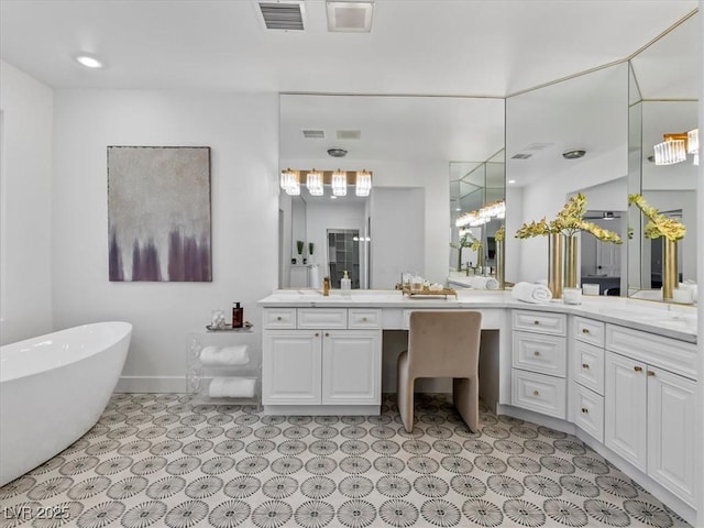 21 Sawgrass Ct, Las Vegas, NV 89113 - full bath with vanity, a soaking tub, and baseboards