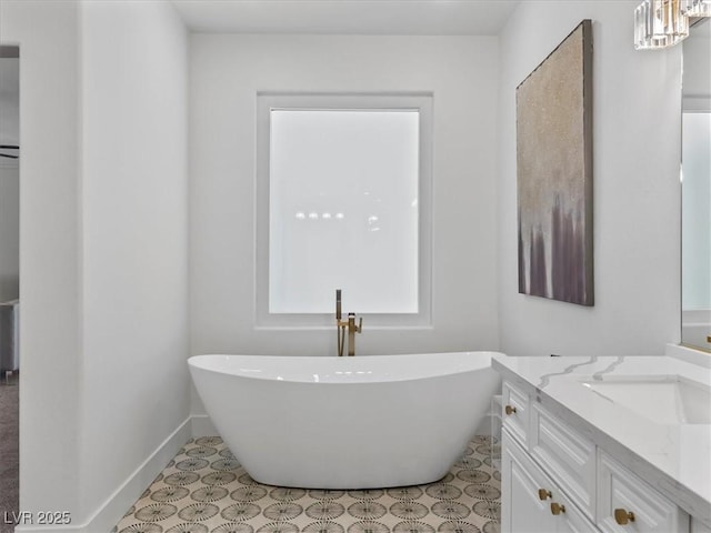 21 Sawgrass Ct, Las Vegas, NV 89113 - full bath with a freestanding tub, vanity, and baseboards