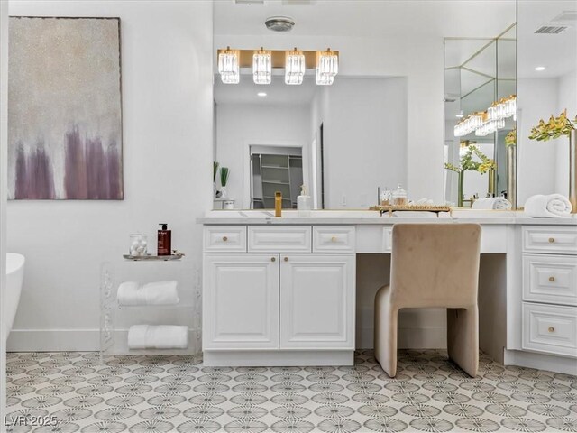 21 Sawgrass Ct, Las Vegas, NV 89113 - full bathroom with vanity, a soaking tub, and baseboards