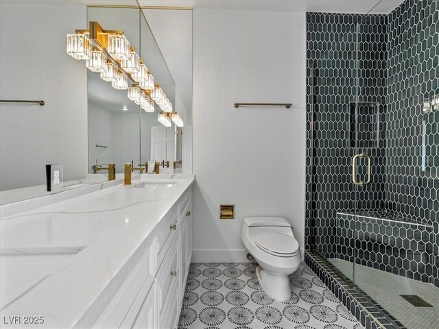 21 Sawgrass Ct, Las Vegas, NV 89113 - full bathroom featuring double vanity, toilet, a shower stall, and tile patterned floors