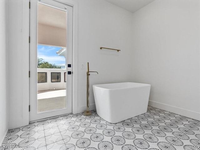21 Sawgrass Ct, Las Vegas, NV 89113 - full bathroom featuring a freestanding tub and baseboards