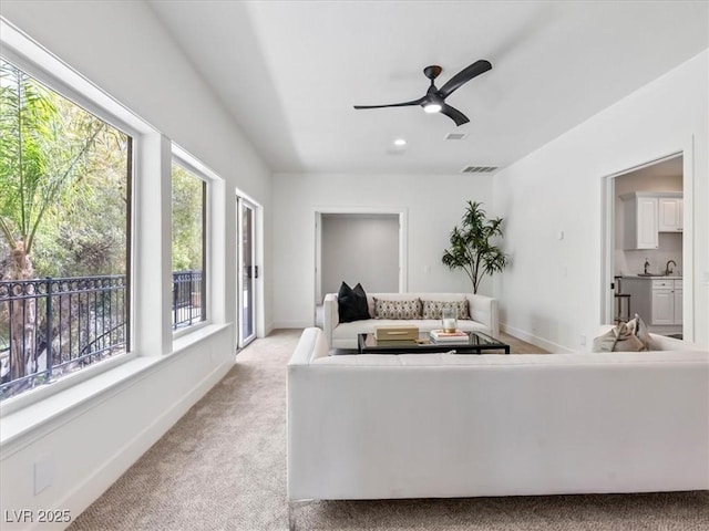 21 Sawgrass Ct, Las Vegas, NV 89113 - living room with light colored carpet, ceiling fan, recessed lighting, and baseboards