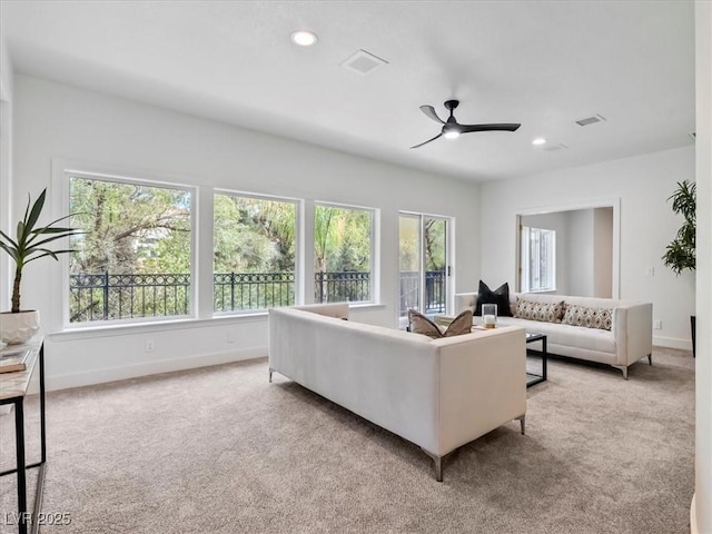 21 Sawgrass Ct, Las Vegas, NV 89113 - living room with carpet flooring, ceiling fan, plenty of natural light, baseboards, and recessed lighting