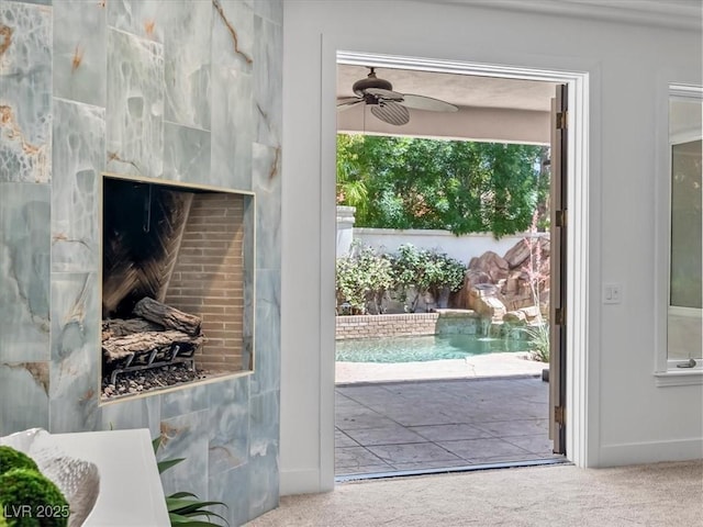 21 Sawgrass Ct, Las Vegas, NV 89113 - doorway to outside featuring carpet, ceiling fan, and baseboards