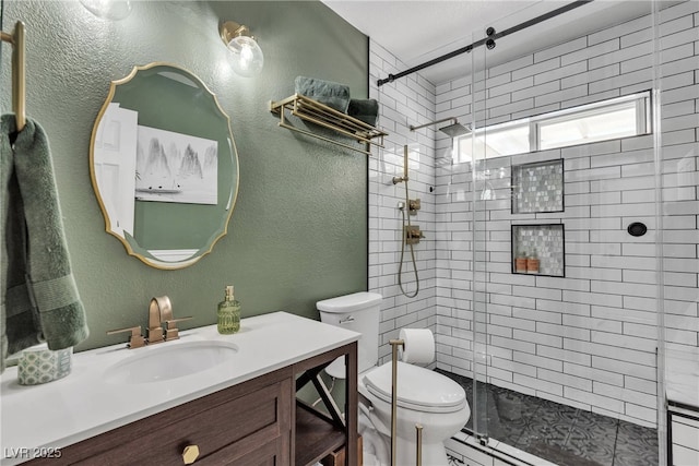9585 Teton Diablo Ave, Las Vegas, NV 89117 - full bath with vanity, a stall shower, toilet, and a textured wall