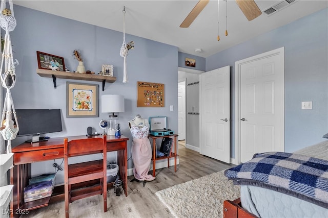 9585 Teton Diablo Ave, Las Vegas, NV 89117 - bedroom featuring wood finished floors and an office area