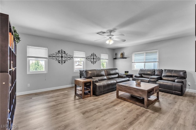 9585 Teton Diablo Ave, Las Vegas, NV 89117 - living room with a ceiling fan, baseboards, and light wood finished floors