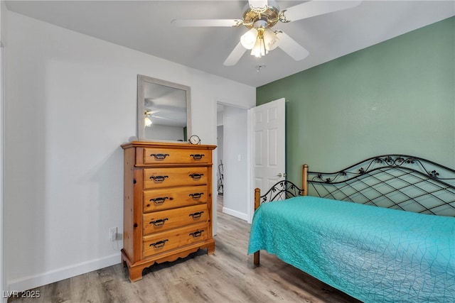 9585 Teton Diablo Ave, Las Vegas, NV 89117 - bedroom with light wood-style flooring, baseboards, and ceiling fan
