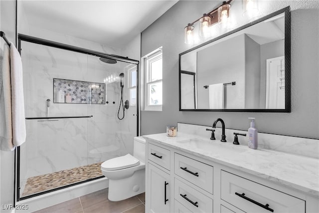 9585 Teton Diablo Ave, Las Vegas, NV 89117 - full bathroom with toilet, vanity, and a marble finish shower