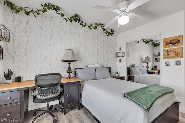 9585 Teton Diablo Ave, Las Vegas, NV 89117 - bedroom with light wood-style floors, an office area, and a ceiling fan