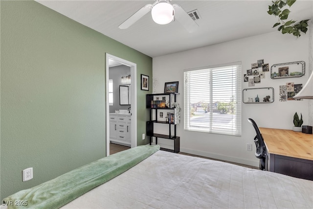 9585 Teton Diablo Ave, Las Vegas, NV 89117 - bedroom featuring ensuite bathroom, baseboards, a ceiling fan, and wood finished floors