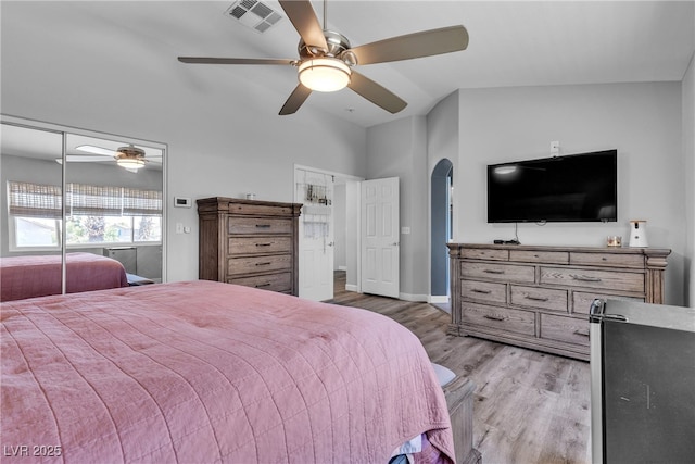 9585 Teton Diablo Ave, Las Vegas, NV 89117 - bedroom with wood finished floors, arched walkways, a ceiling fan, and baseboards