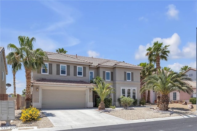 9585 Teton Diablo Ave, Las Vegas, NV 89117 - mediterranean / spanish home with stucco siding, a tiled roof, driveway, and a garage