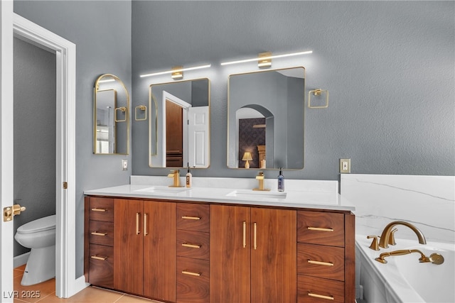 9585 Teton Diablo Ave, Las Vegas, NV 89117 - full bath with double vanity, toilet, a bath, and tile patterned floors
