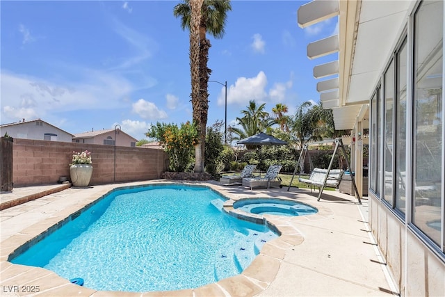 9585 Teton Diablo Ave, Las Vegas, NV 89117 - view of swimming pool featuring a pool with connected hot tub, a patio area, and a fenced backyard