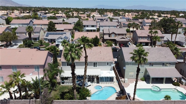 9585 Teton Diablo Ave, Las Vegas, NV 89117 - aerial view of residential area with a pool area and a mountain backdrop