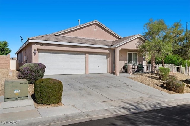4308 Brazil Palm Ct, North Las Vegas, NV 89032 - single story home featuring a garage, concrete driveway, stucco siding, and a tiled roof