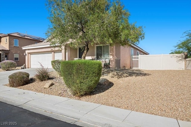 4308 Brazil Palm Ct, North Las Vegas, NV 89032 - view of front of home featuring an attached garage, stucco siding, and concrete driveway
