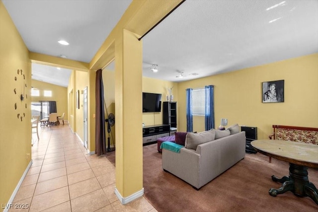 4308 Brazil Palm Ct, North Las Vegas, NV 89032 - living area with light tile patterned floors, baseboards, and lofted ceiling